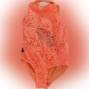 Kandi Kouture Dancewear
Bright orange lace leotard with high neck